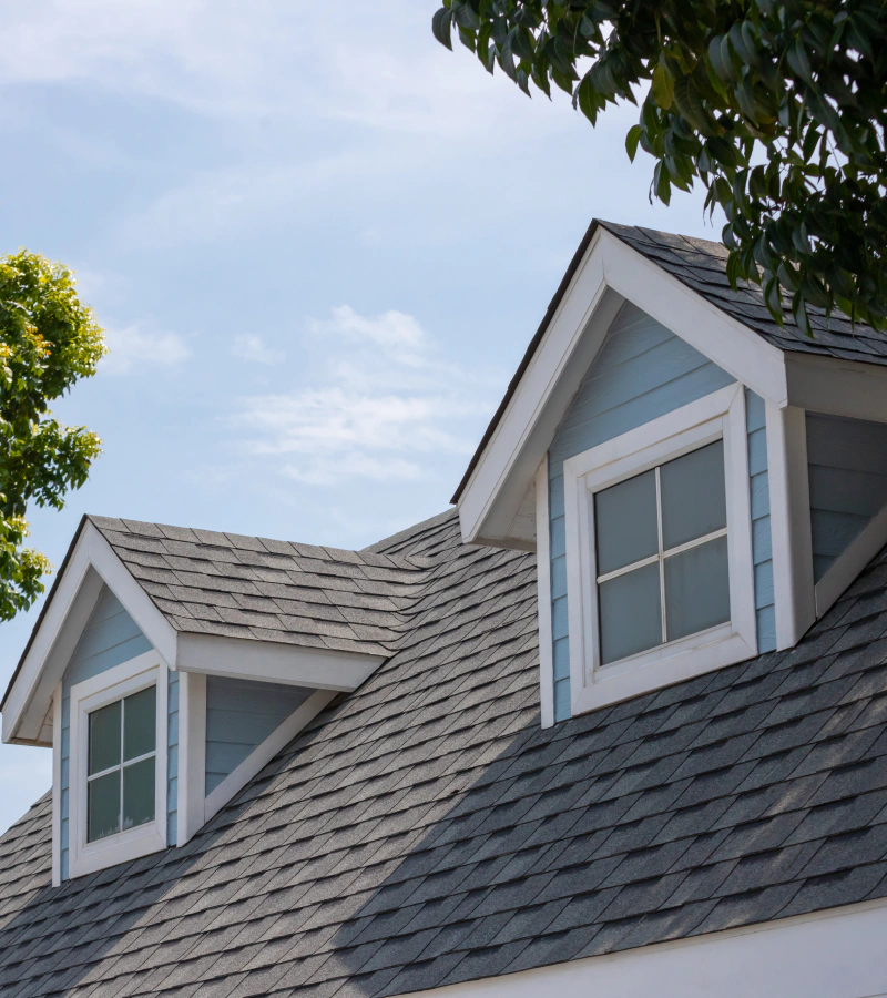 close-up of asphalt shingles on gable roof of family home