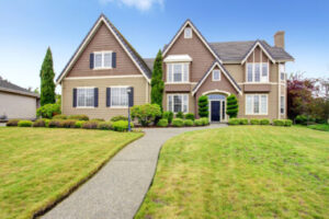 large, suburban home with a large, manicured lawn